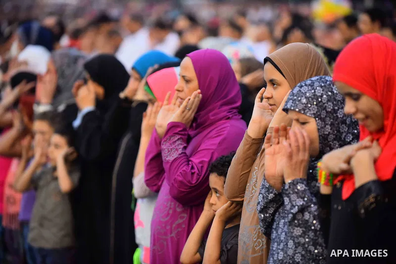 Egyptian Muslims attend the morning prayers for Eid al-Fitr celebrations, which marks the end of the holy fasting month of Ramadan, outside Amr Ibn El-Aas mosque, in Cairo, Egypt, on July 06, 2016. Photo by Amr Sayed