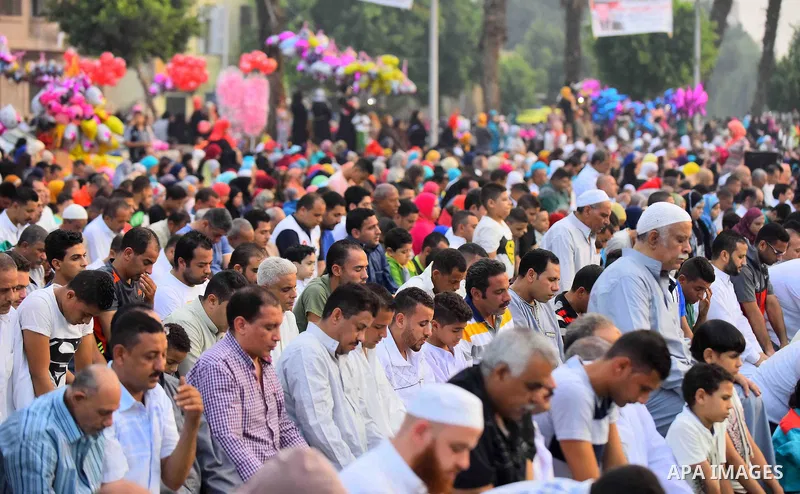 Egyptian Muslims attend the morning prayers for Eid al-Fitr celebrations, which marks the end of the holy fasting month of Ramadan, outside Amr Ibn El-Aas mosque, in Cairo, Egypt, on July 06, 2016. Photo by Amr Sayed