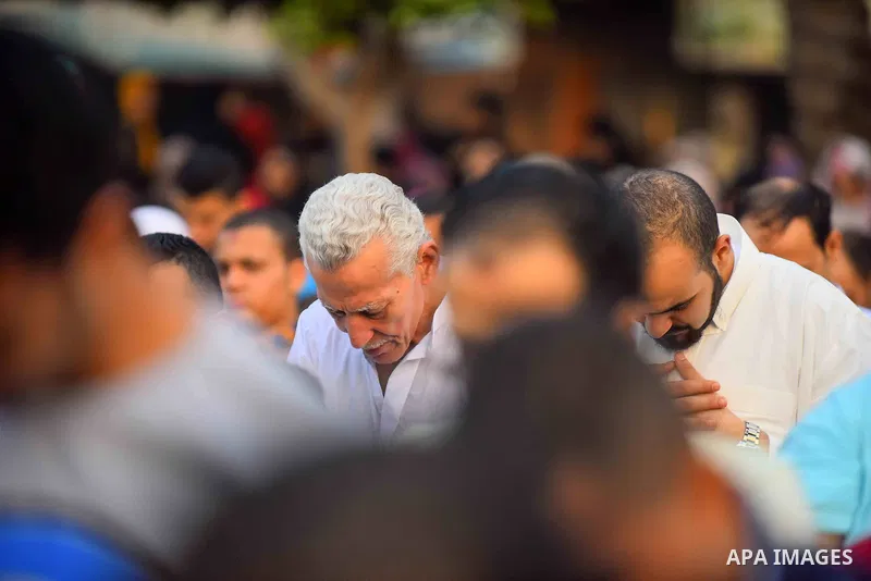 Egyptian Muslims attend the morning prayers for Eid al-Fitr celebrations, which marks the end of the holy fasting month of Ramadan, outside Amr Ibn El-Aas mosque, in Cairo, Egypt, on July 06, 2016. Photo by Amr Sayed