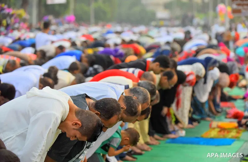 Egyptian Muslims attend the morning prayers for Eid al-Fitr celebrations, which marks the end of the holy fasting month of Ramadan, outside Amr Ibn El-Aas mosque, in Cairo, Egypt, on July 06, 2016. Photo by Amr Sayed