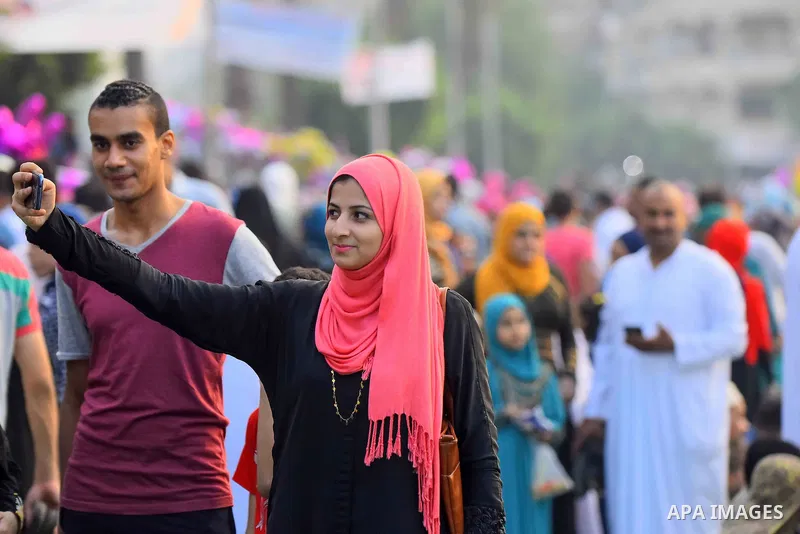 Egyptian Muslims attend the morning prayers for Eid al-Fitr celebrations, which marks the end of the holy fasting month of Ramadan, outside Amr Ibn El-Aas mosque, in Cairo, Egypt, on July 06, 2016. Photo by Amr Sayed