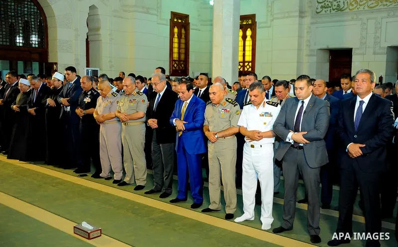 A handout picture released by the Egyptian Presidency on July 4, 2016, shows Egyptian President Abdel Fattah al-Sisi attends the morning prayers for Eid al-Fitr celebrations, which marks the end of the holy fasting month...