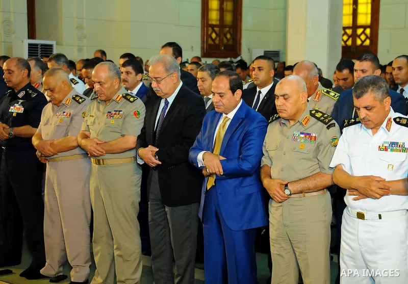 A handout picture released by the Egyptian Presidency on July 4, 2016, shows Egyptian President Abdel Fattah al-Sisi attends the morning prayers for Eid al-Fitr celebrations, which marks the end of the holy fasting month...