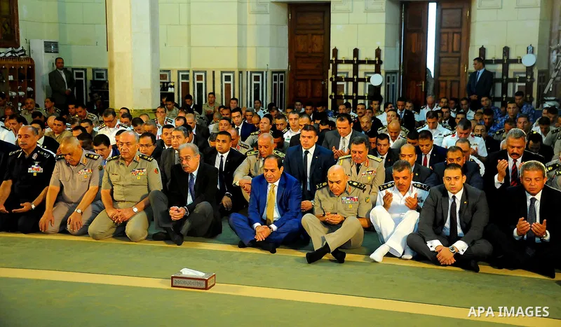 A handout picture released by the Egyptian Presidency on July 4, 2016, shows Egyptian President Abdel Fattah al-Sisi attends the morning prayers for Eid al-Fitr celebrations, which marks the end of the holy fasting month...