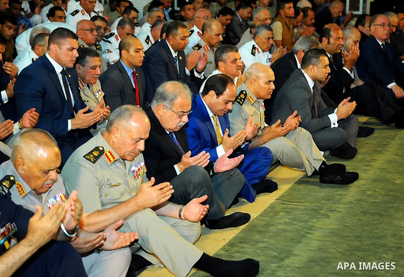 A handout picture released by the Egyptian Presidency on July 4, 2016, shows Egyptian President Abdel Fattah al-Sisi attends the morning prayers for Eid al-Fitr celebrations, which marks the end of the holy fasting month...