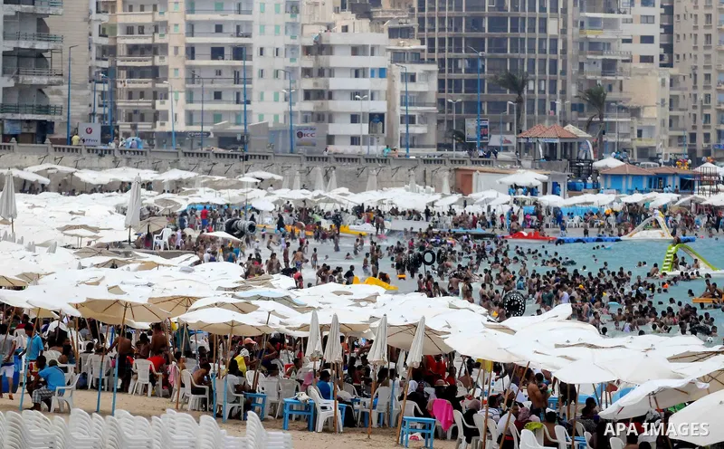 Egyptians crowd a slide at a public beach on the first day of Eid al-Fitr celebrations, which marks the end of the holy fasting month of Ramadan, in the Mediterranean city of Alexandria, in the north of Cairo July 6, 201...