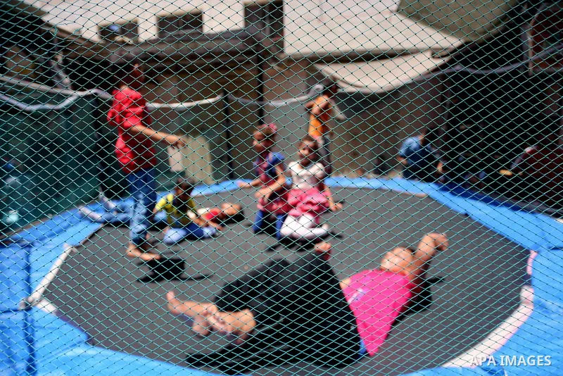 Palestinian children play on the second day of of Eid al-Fitr celebrations, which marks the end of the holy fasting month of Ramadan, at the al-Shati refugee camp in Gaza City on July 7, 2016. Photo by Mohammed Asad