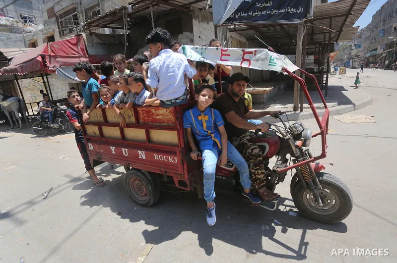 Palestinian children play on the second day of of Eid al-Fitr celebrations, which marks the end of the holy fasting month of Ramadan, at the al-Shati refugee camp in Gaza City on July 7, 2016. Photo by Mohammed Asad
