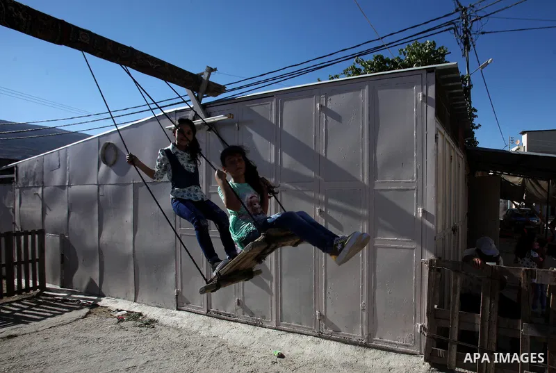 Palestinian children play to celebrate Eid al-Fitr during the second day of the holiday of Eid al-Fitr marking the end of Islam's fasting holy month of Ramadan, in the West Bank city of Nablus, on July 7, 2016. Photo by...