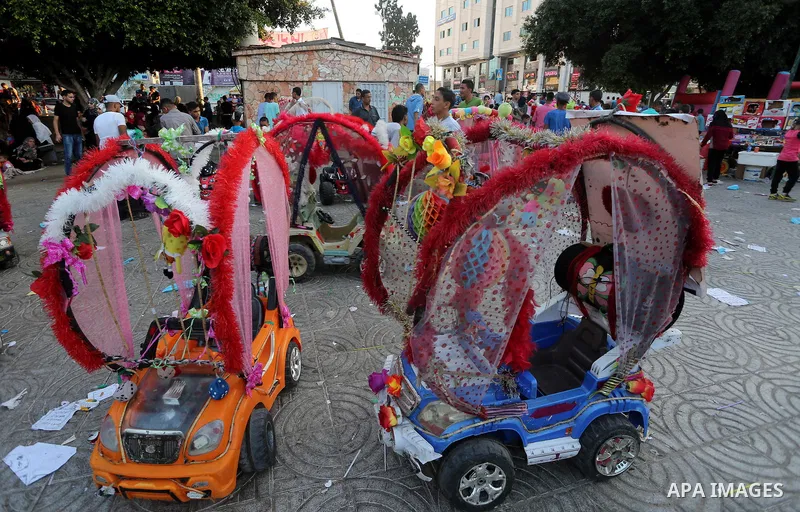 Palestinian children play on the second day of of Eid al-Fitr celebrations, which marks the end of the holy fasting month of Ramadan, in Gaza City on July 7, 2016. Photo by Mohammed Asad