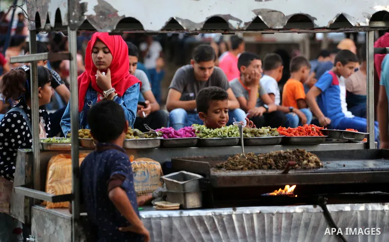 Palestinian children play on the second day of of Eid al-Fitr celebrations, which marks the end of the holy fasting month of Ramadan, in Gaza City on July 7, 2016. Photo by Mohammed Asad