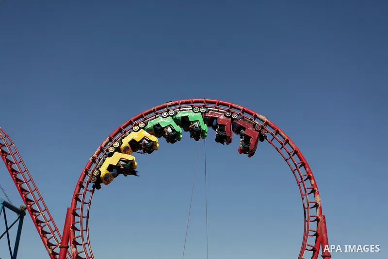 Palestinians take a ride at an amusement park on the third day of Eid al-Fitr holiday which marks the end of the Muslim holy month of Ramadan, in Gaza City on July 08, 2016. Photo by Ashraf Amra