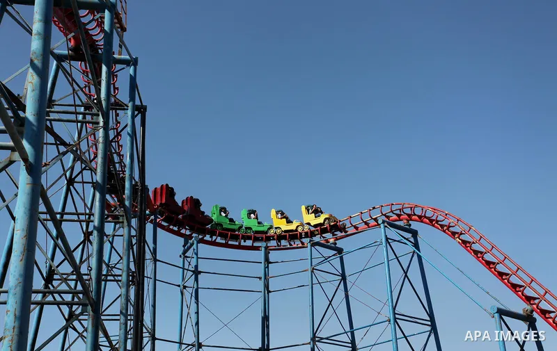 Palestinians take a ride at an amusement park on the third day of Eid al-Fitr holiday which marks the end of the Muslim holy month of Ramadan, in Gaza City on July 08, 2016. Photo by Ashraf Amra