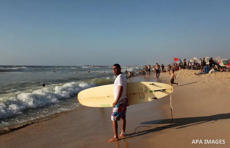 Palestinians enjoy a day at the beach of the Mediterranean sea on the coast of Gaza city, on the third day of Eid al-Fitr holiday which marks the end of the Muslim holy month of Ramadan, on July 08, 2016. Photo by Ashraf...