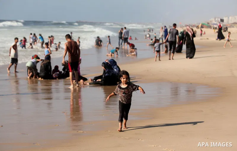 Palestinians enjoy a day at the beach of the Mediterranean sea on the coast of Gaza city, on the third day of Eid al-Fitr holiday which marks the end of the Muslim holy month of Ramadan, on July 08, 2016. Photo by Ashraf...