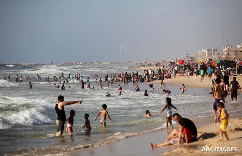 Palestinians enjoy a day at the beach of the Mediterranean sea on the coast of Gaza city, on the third day of Eid al-Fitr holiday which marks the end of the Muslim holy month of Ramadan, on July 08, 2016. Photo by Ashraf...