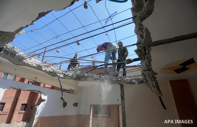 Palestinian construction workers work at the house, to marking the second anniversary of the 50-day Israeli war on Gaza Strip last summer, in Shejaiya neighborhood in Gaza city July 9, 2016. July 8th marks the two-year a...