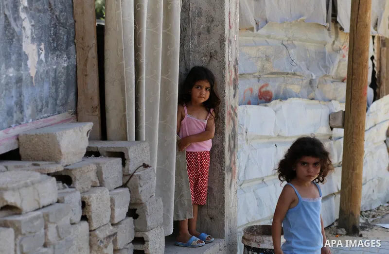 Palestinian construction workers work at the house, to marking the second anniversary of the 50-day Israeli war on Gaza Strip last summer, in Shejaiya neighborhood in Gaza city July 9, 2016. July 8th marks the two-year a...