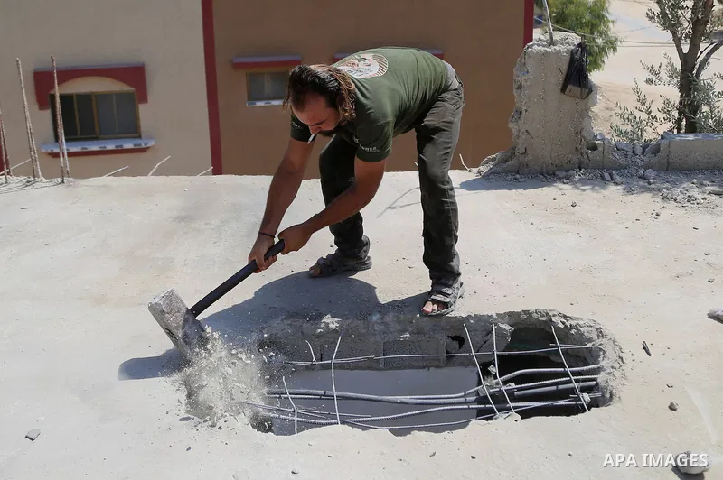 Palestinian construction workers work at the house, to marking the second anniversary of the 50-day Israeli war on Gaza Strip last summer, in Shejaiya neighborhood in Gaza city July 9, 2016. July 8th marks the two-year a...