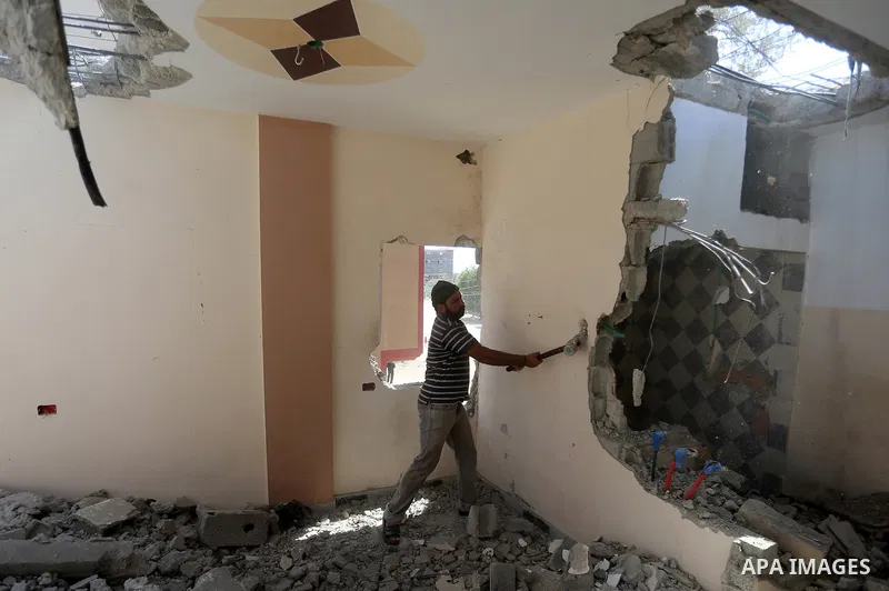 Palestinian construction workers work at the house, to marking the second anniversary of the 50-day Israeli war on Gaza Strip last summer, in Shejaiya neighborhood in Gaza city July 9, 2016. July 8th marks the two-year a...