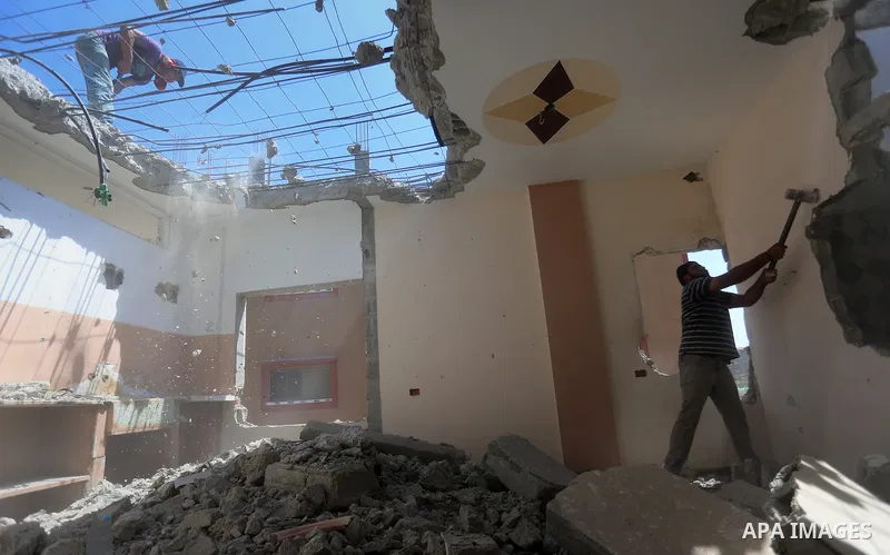 Palestinian construction workers work at the house, to marking the second anniversary of the 50-day Israeli war on Gaza Strip last summer, in Shejaiya neighborhood in Gaza city July 9, 2016. July 8th marks the two-year a...