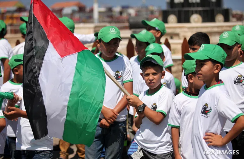 Palestinian children take part in a summer camp organized by Hamas movement in Gaza city on July 10, 2016. Hamas movement organized dozens of summer camps for Palestinian children during the period of school holidays. Ph...