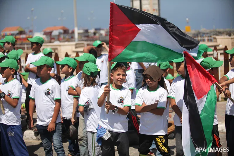 Palestinian children take part in a summer camp organized by Hamas movement in Gaza city on July 10, 2016. Hamas movement organized dozens of summer camps for Palestinian children during the period of school holidays. Ph...