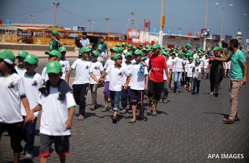 Palestinian children take part in a summer camp organized by Hamas movement in Gaza city on July 10, 2016. Hamas movement organized dozens of summer camps for Palestinian children during the period of school holidays. Ph...