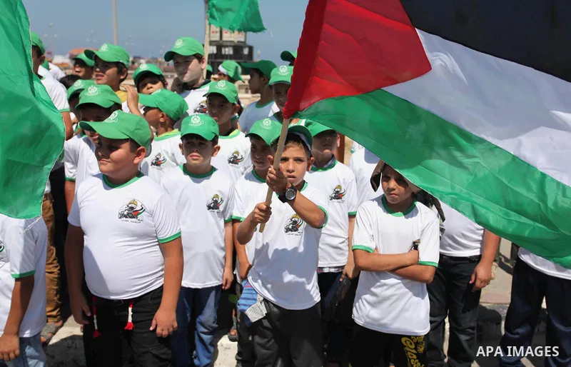 Palestinian children take part in a summer camp organized by Hamas movement in Gaza city on July 10, 2016. Hamas movement organized dozens of summer camps for Palestinian children during the period of school holidays. Ph...