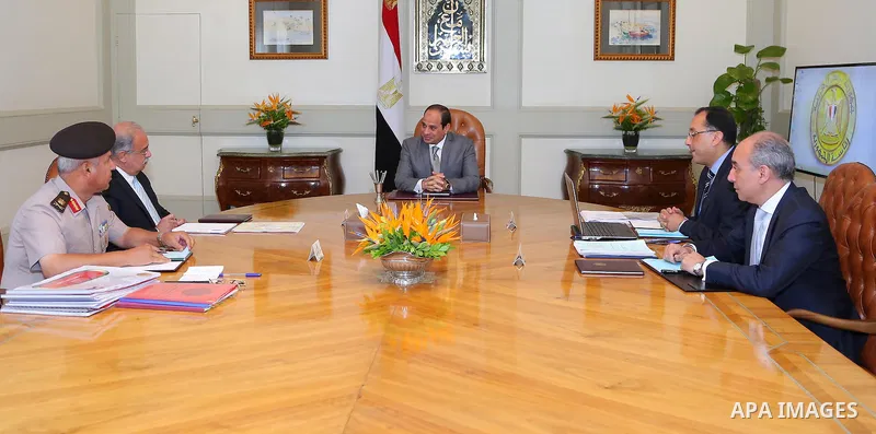 Egyptian President Abdel Fattah al-Sisi meets with Egyptian Prime Minister Sharif Ismail and Mustafa Madbouli, Housing Minister, in Cairo, Egypt, on July 10, 2016. Photo by Egyptian President Office