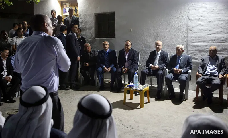 Palestinian Prime Minister Rami Hamdallah offers condolences to the Family of Palestinian Yasser Nazzal, in the West Bank, City of Jenin, on July 10, 2016. Photo by Prime Minister Office