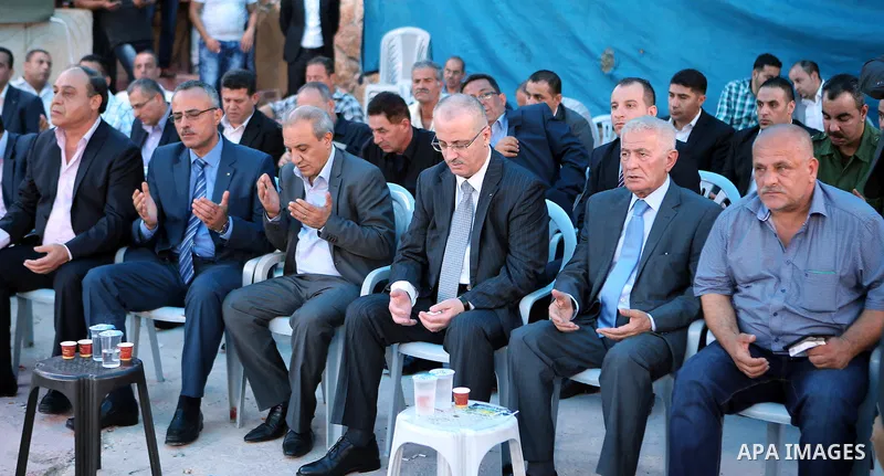 Palestinian Prime Minister Rami Hamdallah offers condolences to the Family of Palestinian Yasser Nazzal, in the West Bank, City of Jenin, on July 10, 2016. Photo by Prime Minister Office