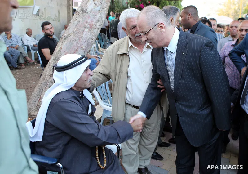 Palestinian Prime Minister Rami Hamdallah offers condolences to the Family of Palestinian Yasser Nazzal, in the West Bank, City of Jenin, on July 10, 2016. Photo by Prime Minister Office