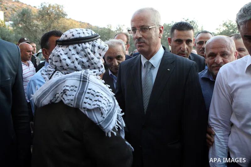 Palestinian Prime Minister Rami Hamdallah offers condolences to the Family of Palestinian Yasser Nazzal, in the West Bank, City of Jenin, on July 10, 2016. Photo by Prime Minister Office