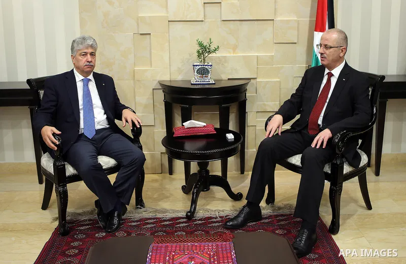 Palestinian Prime Minister, Rami Hamdallah, receives the Annual report of the Retirement Authority for 2015 in the West Bank city of Ramallah on July 11 , 2016. Photo by Prime Minister Office