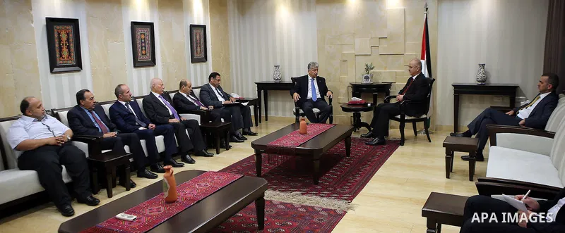Palestinian Prime Minister, Rami Hamdallah, receives the Annual report of the Retirement Authority for 2015 in the West Bank city of Ramallah on July 11 , 2016. Photo by Prime Minister Office