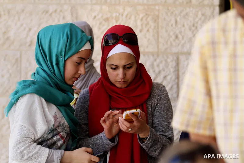 Palestinian high school students celebrate after heard their results of final exams known as "Tawjihi", in the West Bank city of Nablus on July 11, 2016. Photo by Nedal Eshtayah