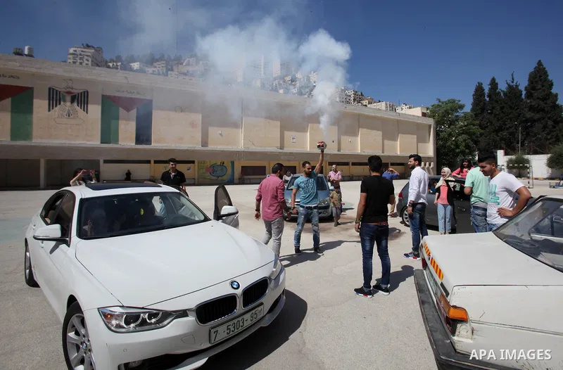 Palestinian high school students celebrate after heard their results of final exams known as "Tawjihi", in the West Bank city of Nablus on July 11, 2016. Photo by Nedal Eshtayah