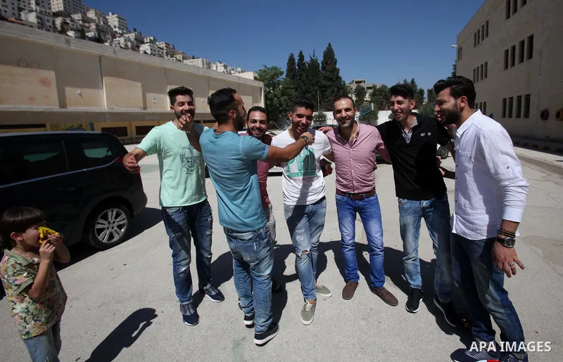 Palestinian high school students celebrate after heard their results of final exams known as "Tawjihi", in the West Bank city of Nablus on July 11, 2016. Photo by Nedal Eshtayah