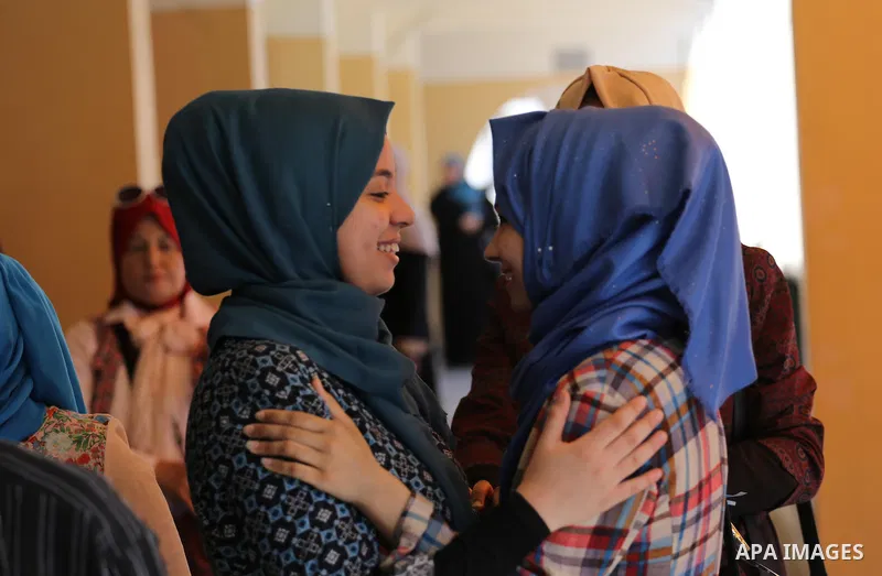 Palestinian high school students celebrate after heard their results of final exams known as "Tawjihi" in Gaza city on July 11, 2016. Photo by Mohammed Asad