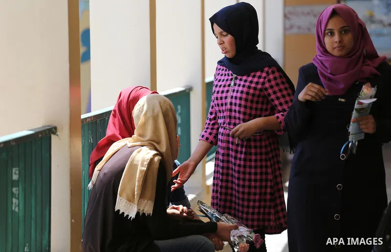 Palestinian high school students look for their results of final high school exams, known as "Tawjihi" in Gaza city on July 11, 2016. Photo by Mohammed Asad