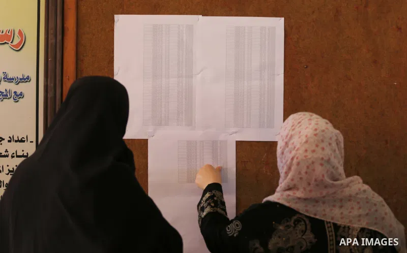 Palestinian high school students look for their results of final high school exams, known as "Tawjihi" in Gaza city on July 11, 2016. Photo by Mohammed Asad
