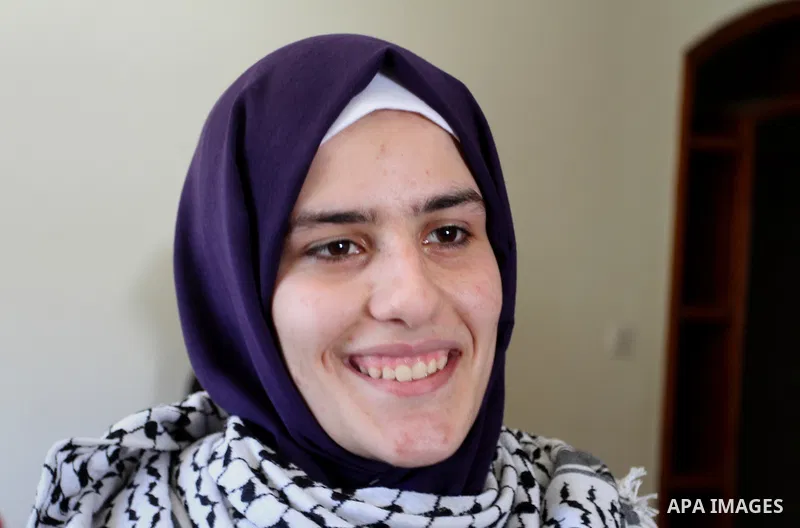 A Palestinian high school student, Sabrin Sheikh Ahmed 99.4, celebrates with her family after heard the results of her final exams known as ''Tawjihi'', in Khan Younis in the southern Gaza strip, on July 11, 2016. Photo...