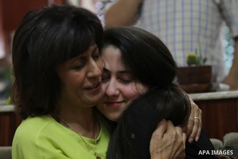A Palestinian high school student, Yasmin Murad Suleiman 99.4, celebrates with her family after heard the results of her final exams known as ''Tawjihi'', in the West Bank city of Nablus, on July 11, 2016. Photo by Nedal...