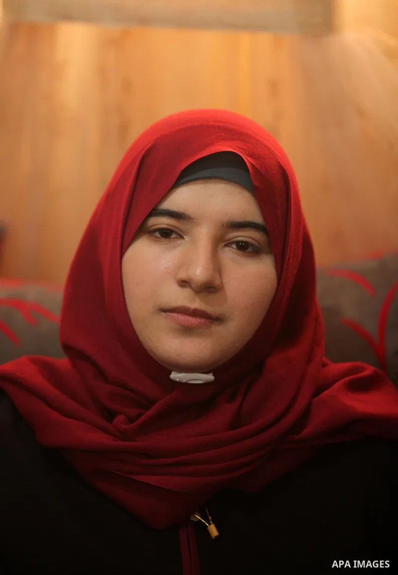 A Palestinian high school student,Amani Mohammed Shatat 99.6, celebrates with her family after heard the results of her final exams known as ''Tawjihi'', in the Gaza city, on July 11, 2016. Photo by Ashraf Amra