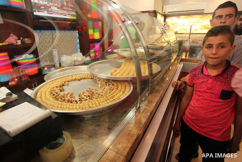 Palestinian vendors sell sweets after the results of high school exams, known as ''Tawjihi''', in Gaza city, on July 11, 2016. Photo by Ashraf Amra