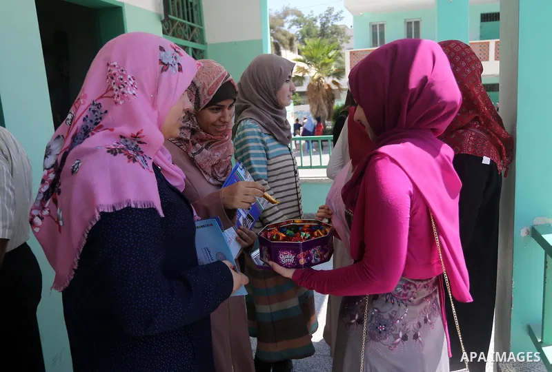 Palestinian high school students celebrate after heard their results of final exams known as "Tawjihi" in Gaza city on July 12, 2016. Photo by Mohammed Asad