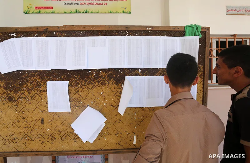 Palestinian high school students look for their results of final high school exams, known as "Tawjihi" in Gaza city on July 12, 2016. Photo by Mohammed Asad