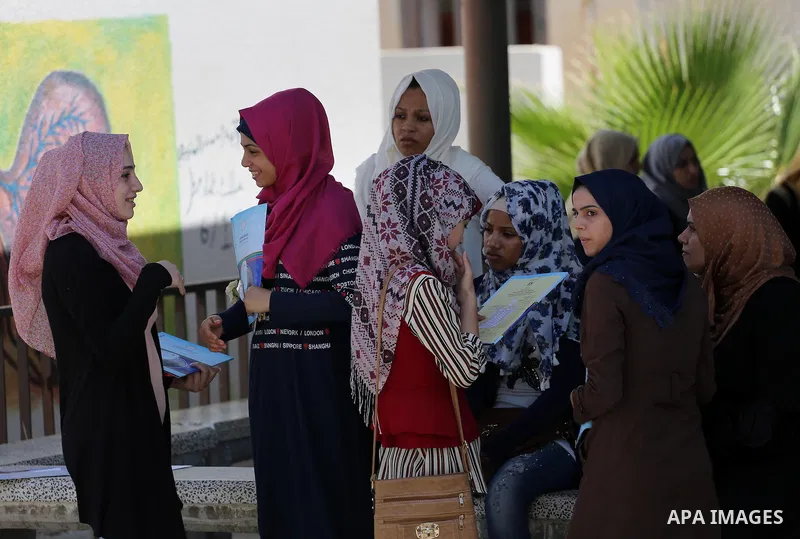 Palestinian high school students celebrate after heard their results of final exams known as "Tawjihi" in Gaza city on July 12, 2016. Photo by Mohammed Asad