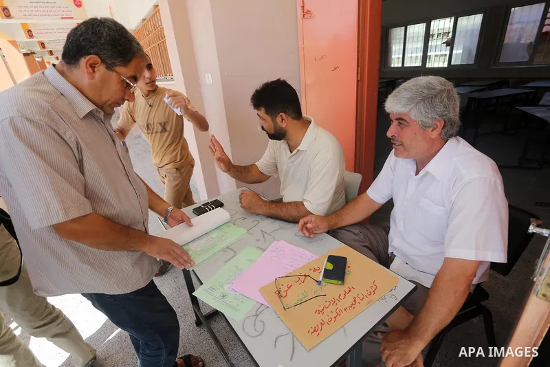 Palestinian high school students look for their results of final high school exams, known as "Tawjihi" in Gaza city on July 12, 2016. Photo by Mohammed Asad